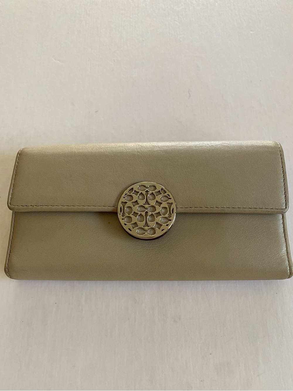 Coach Leather Trifold Clutch Wallet with Decorative Round Clasp - Taupe